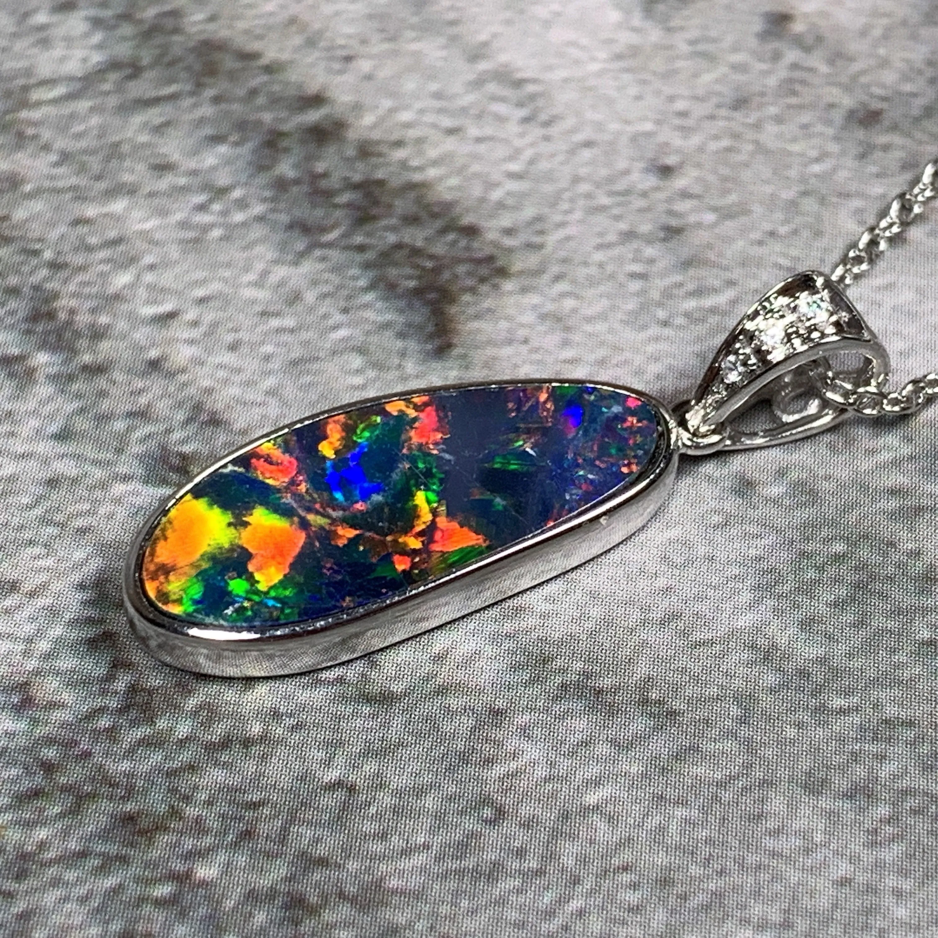 14kt White Gold Fire Opal 17.8x6.6mm and Diamond pendant