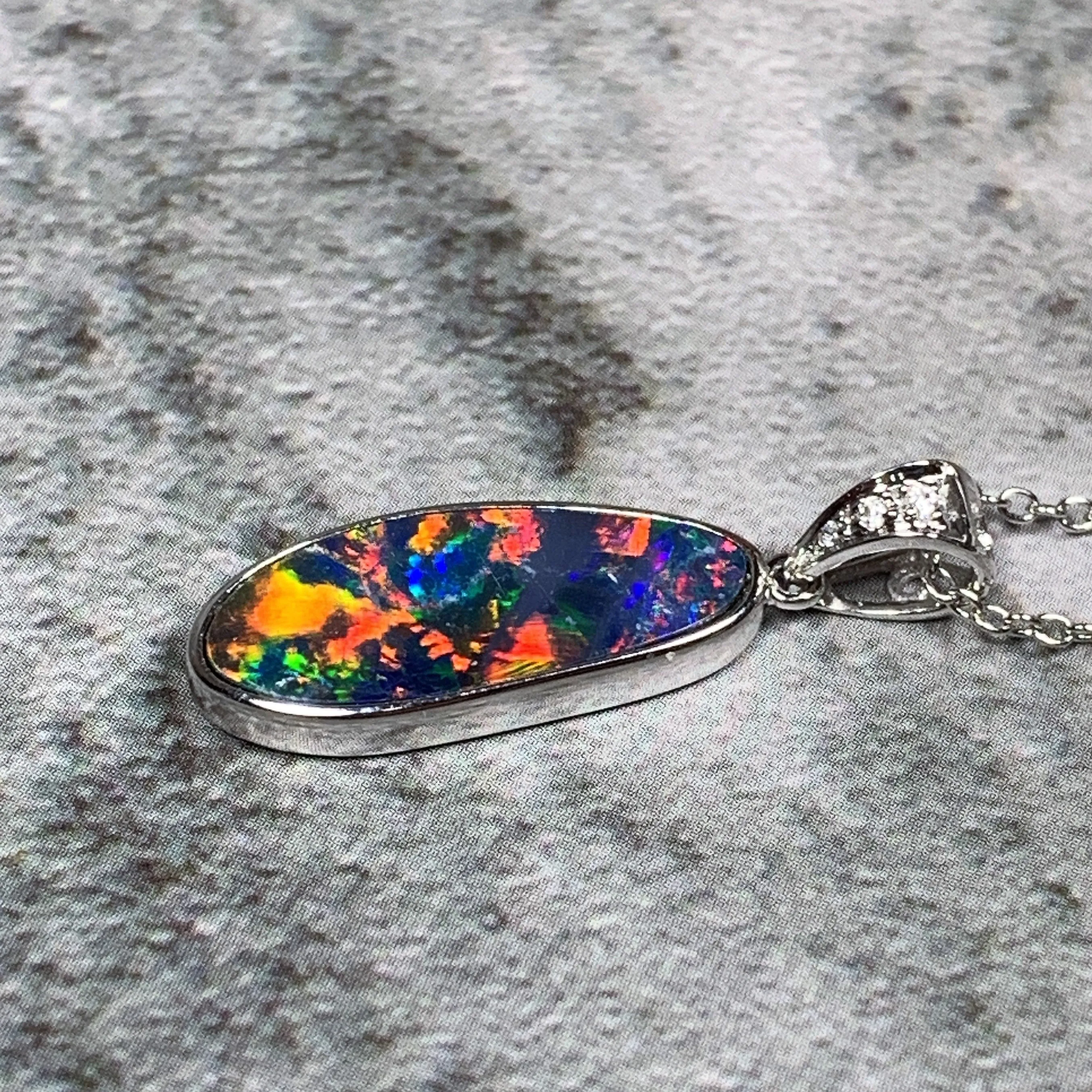 14kt White Gold Fire Opal 17.8x6.6mm and Diamond pendant